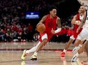 Portland Trail Blazers guard Anfernee Simons drives against the Dallas Mavericks during the second half of an NBA basketball game Friday, Dec. 8, 2023, in Portland, Ore. (AP Photo/Howard Lao) AP