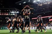 Oregon State’s Taliese Fuaga (75) lifts running back Kanoa Shannon (29) after Shannon scored a touchdown as the Beavers take on the Montana State Bobcats in a college football game at Providence Park in Portland on Saturday, Sept. 17, 2022. Oregon State won 68-28.