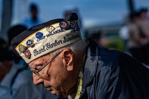 A closeup of Herb Elfring, in profile, wearing a Pearl Harbor survivor military cap