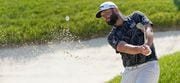 Jon Rahm, of Spain, hits out of a bunker to the 18th green during the first round of the Memorial golf tournament, Thursday, June 1, 2023, in Dublin, Ohio. (AP Photo/Darron Cummings)