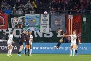 Portland Thorns defender Natalia Kuikka (#14) deflects a pass with a header during a semifinal match of the NWSL playoffs against  NJ/NY Gotham FC at Providence Park on Sunday, Nov. 5 2023. 