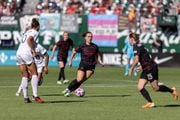 Portland Thorns midfielder Sam Coffey weaves through the defense with possession during an NWSL match against NJ/NY Gotham FC at Providence Park on Saturday, Oct. 7, 2023. 
