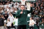 New Michigan State head coach Jonathan Smith addresses the fans during the first half of an NCAA college basketball game between Michigan State and Georgia Southern, Tuesday, Nov. 28, 2023, in East Lansing, Mich. (AP Photo/Carlos Osorio)