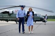 President Joe Biden and first lady Jill Biden walk to board Air Force One for departure at Gainesville Regional Airport after surveying damage caused by Hurricane Idalia, Saturday, Sept. 2, 2023, in Gainesville, Fla. (AP Photo/Julio Cortez)
