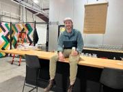 Gus Everson sits atop his new bar and has his photo taken during an interview session on Thursday. Recluse Brew Works opens Saturday, Dec. 2, at Building #20, 4035 N. Grant St., Suite 102, Washougal.