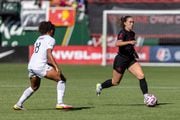 Portland Thorns midfielder Sam Coffey pushes the ball ahead during an NWSL match against NJ/NY Gotham FC at Providence Park on Saturday, Oct. 7, 2023. 