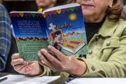 Micaela Muro of Elk Grove reads a book during a Spanish class at Class de Español ealier this month.